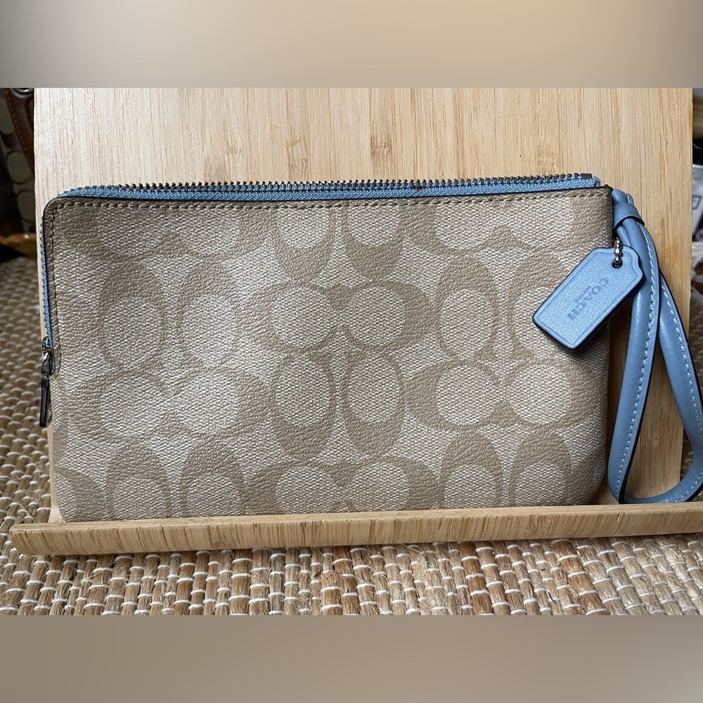 Coach clutch w/wrist strap. 5 x 8